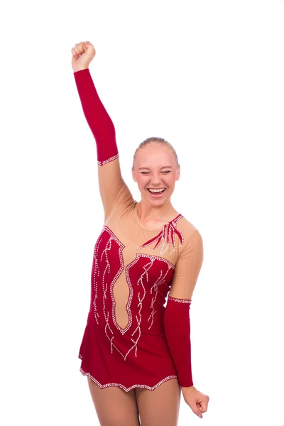 Beautiful happy girl gymnast winner with hand over head — Stock Photo, Image