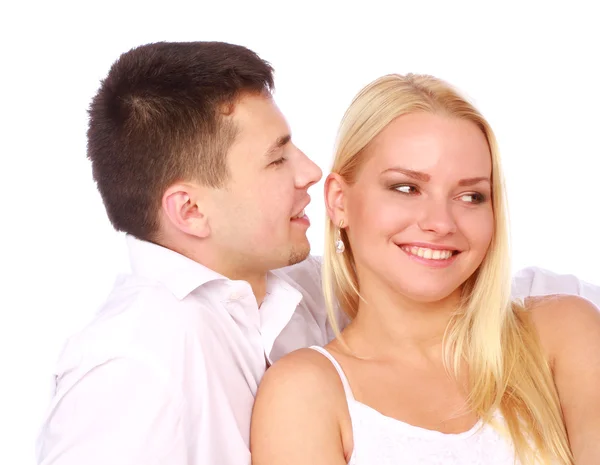 Um casal feliz apaixonado. Homem sussurra um elogio . — Fotografia de Stock