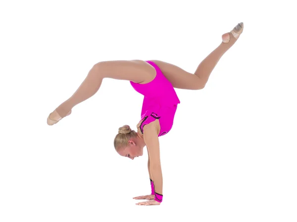 Gymnastic girl standing on hands — Stock fotografie