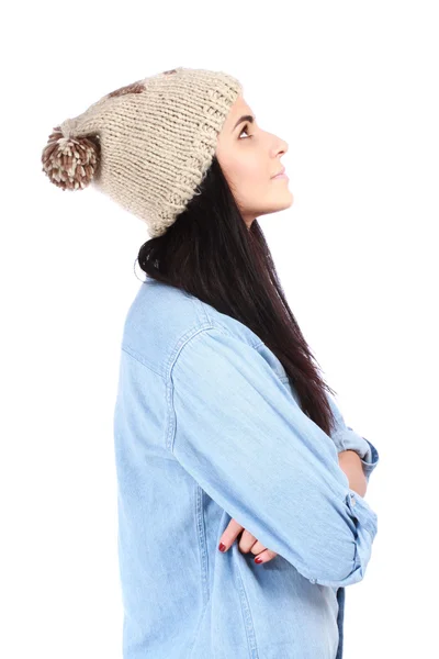 Portrait of young woman in jeans shirt and cap looking right up — Stock Photo, Image