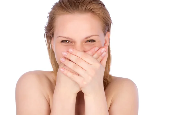 Attractive teenage girl laughing with hands on her mouth — Stock Photo, Image