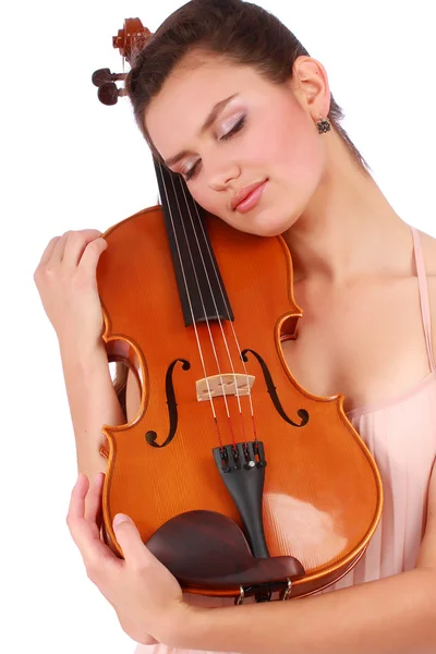 Violoniste attrayant posant avec violon et les yeux fermés Photo De Stock