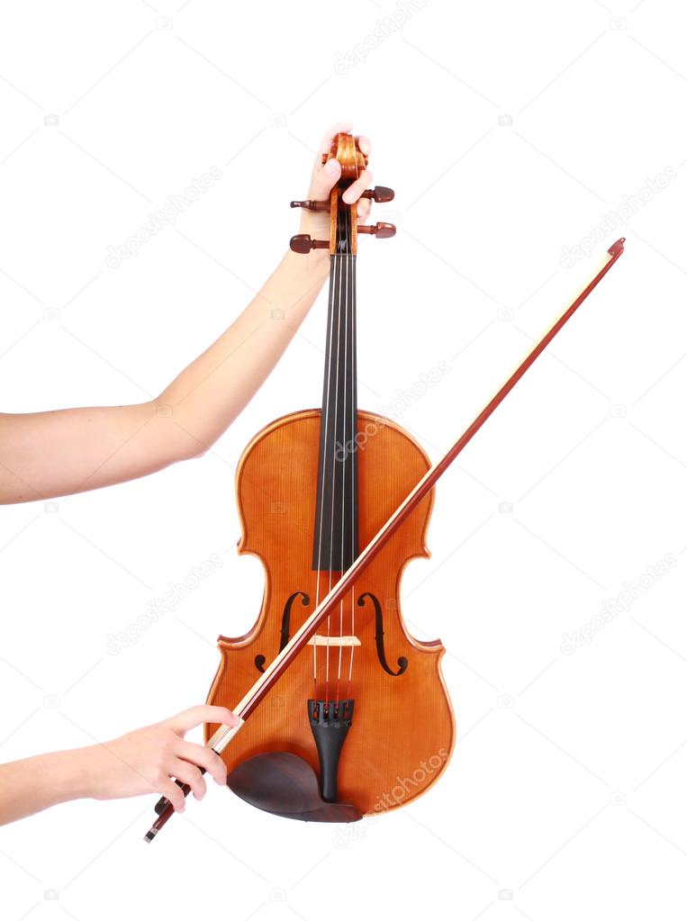 Vintage violin and fiddle stick in woman hands