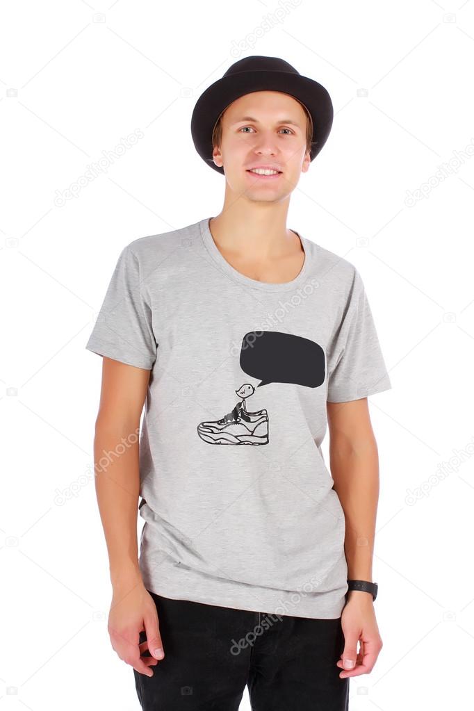Young guy in a hat and casual t-shirt half length portrait