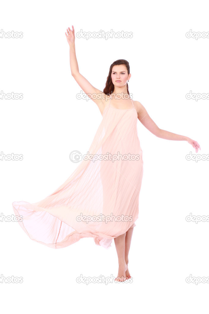 Graceful girl in flying light pink dress