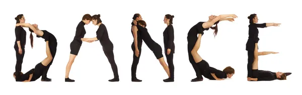 Black dressed people forming DANCE word over white — Stock Photo, Image