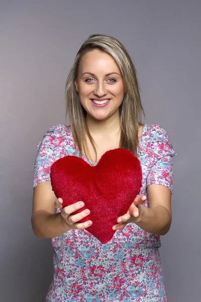 Lovely attractive girl with heart — Stock Photo, Image