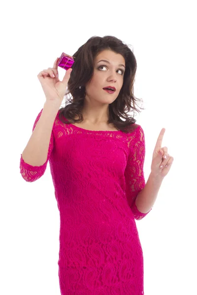 Woman looking up and holding small gift — Stock Photo, Image