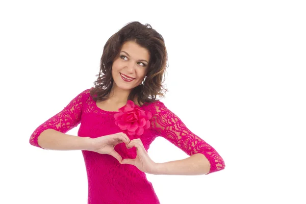 Happy girl makes a heart with her hands — Stock Photo, Image