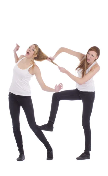 Gemini hermanas luchando sobre un fondo blanco — Foto de Stock