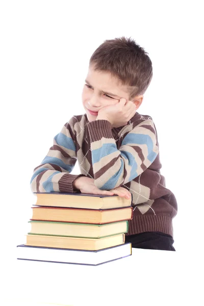 Young boy with books isolated over white background — Stock Photo, Image