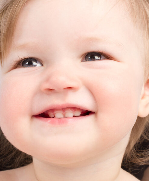 Close up portrait of little smiling child