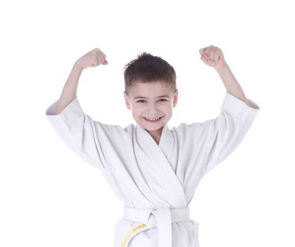 Young boy fighter in kimono with hand up isolated on white background — Stock Photo, Image