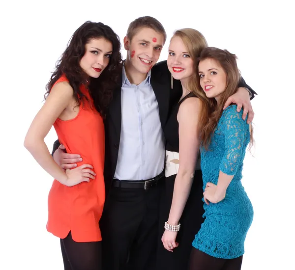 Young man with three girls and lipstick kiss-marks — Stock Photo, Image