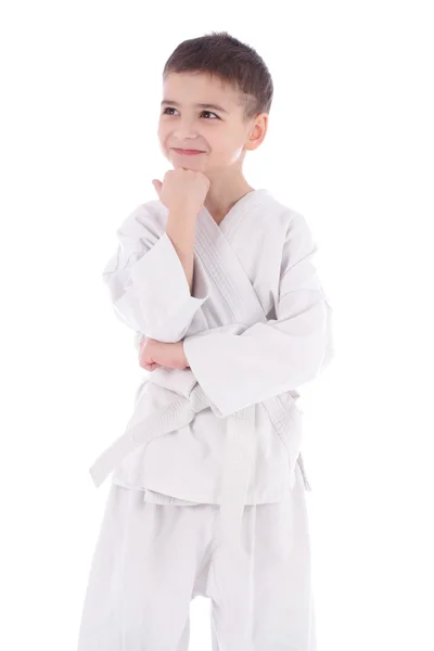 A young boy fighter in white kimono isolated on white background — Stock Photo, Image