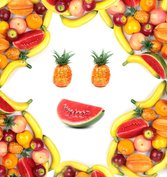 Frame of human face with assortment of various fruits — Stock Photo, Image