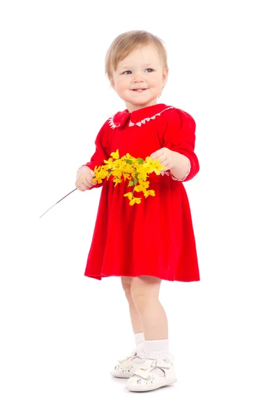 Joyeux petite fille avec fleur jaune isolé sur fond blanc Images De Stock Libres De Droits