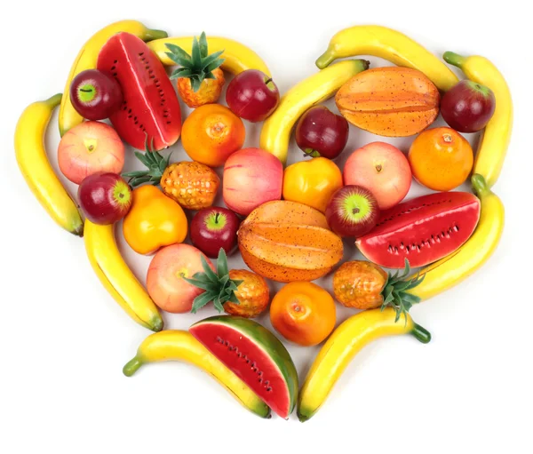 Sortiment av olika frukter hjärtformade över vit bakgrund Royaltyfria Stockfoton
