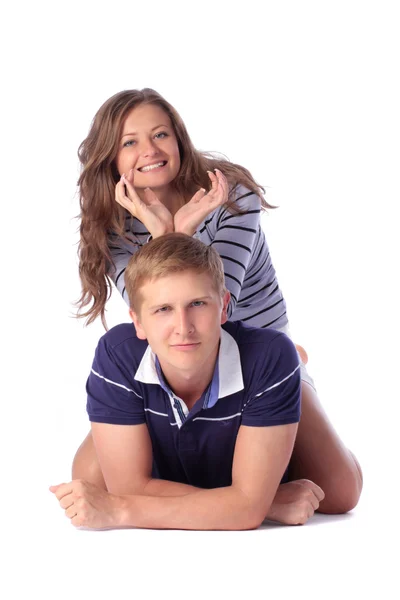 Girl holding her hands in a horn pattern over her boyfriend — Stock Photo, Image