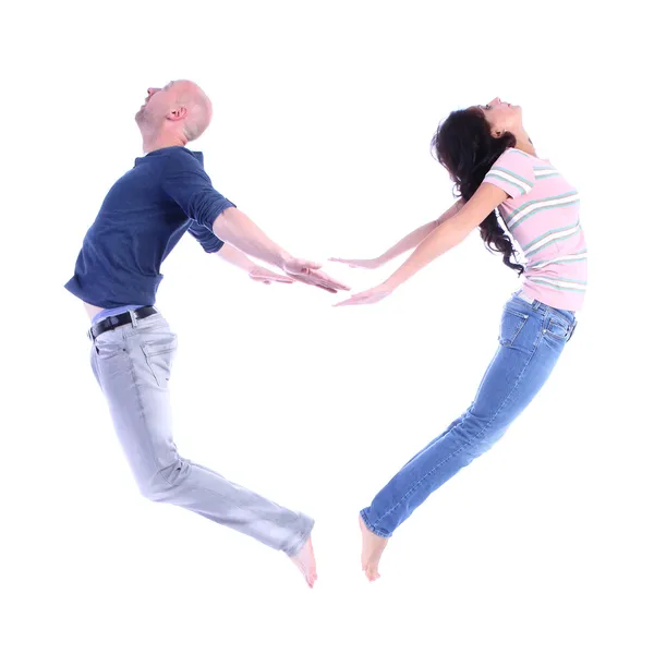 Acrobatic couple forming a heart shape — Stock Photo, Image