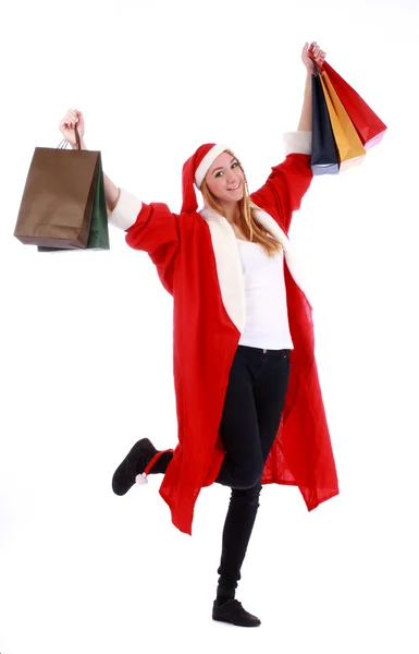 クリスマスのショッピング、サンタの帽子を着ている女性 — ストック写真