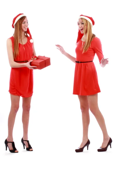 Christmas girls hold a gift — Stock Photo, Image