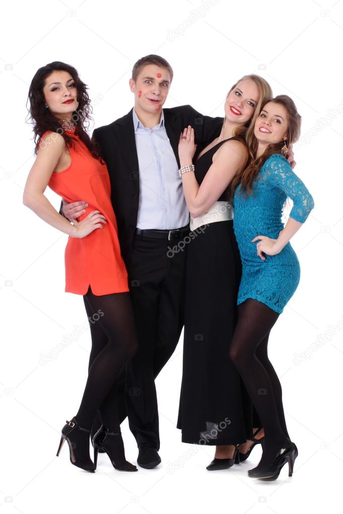 Young man with three girls and lipstick kiss-marks