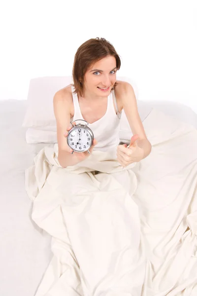 Vrouw wakker in bed. Stockfoto