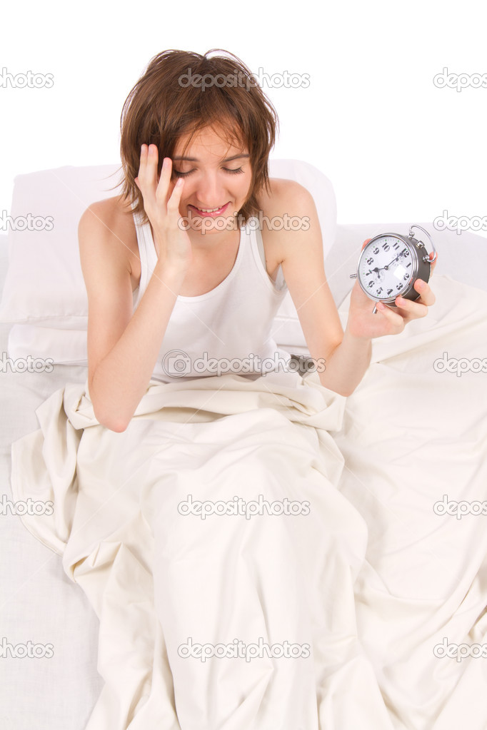 Woman waking up in bed.