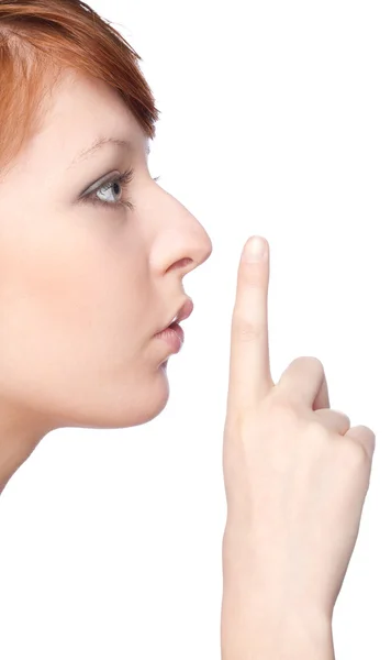 Фото молодой женщины с пальцем на губах — стоковое фото