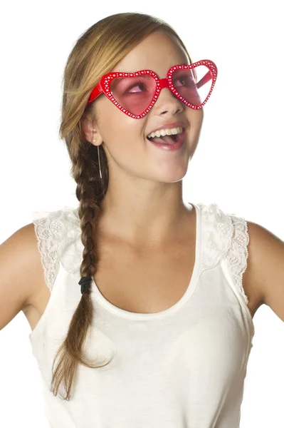 Brunette dreaming girl in heart-shape glasses — Stock Photo, Image