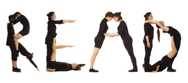 Group of people forming the word "READ" — Stock Photo, Image