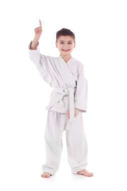 genç çocuk savaşçı beyaz kimono parmak göstermek yukarıya içinde
