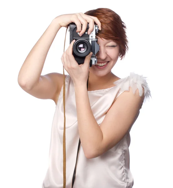 Aantrekkelijke jonge meisje met een camera — Stockfoto