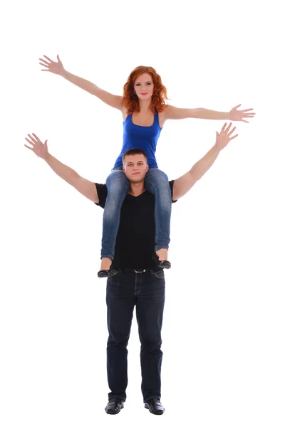 Portrait of a happy young girl enjoying piggyback ride on her boyfriend back — Stock Photo, Image