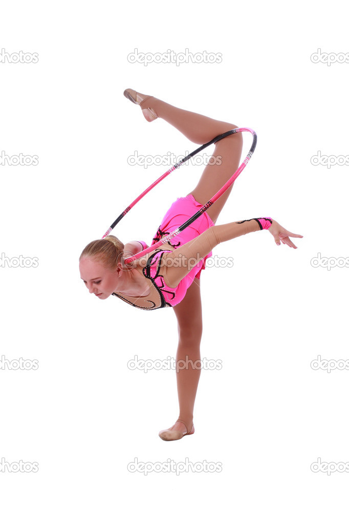 Beautiful slim girl gymnast in a costume with a hoop
