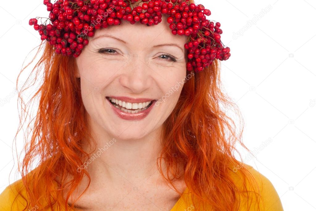 Woman with red berries on head