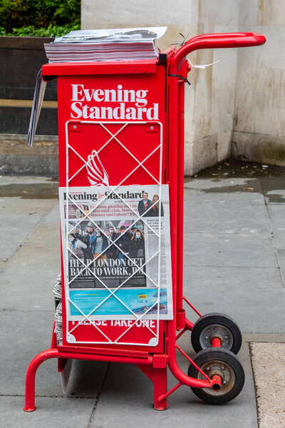 London, UK - May 13th 2021: A newspaper stand on Waterloo Place in London, UK, offering copies of the Evening Standard Newspaper.