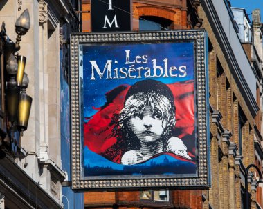 London, UK - March 8th 2022: A promotional billboard on the exterior of the Sondheim Theatre on Shaftesbury Avenue in London, UK, promoting its current show Les Miserables.