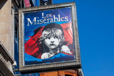 London, UK - March 8th 2022: The exterior of the Sondheim Theatre on Shaftesbury Avenue in London, UK, promoting its current musical Les Miserables. clipart