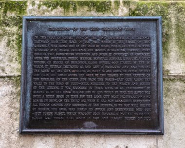 London, UK - March 17th 2022: An information plaque on the base of the Monument to the Great Fire of London, in the City of London, UK.