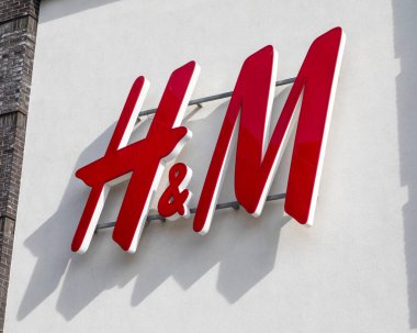 Norfolk, UK - April 8th 2022: Close-up of the H&M logo on the exterior of one of their stores in the United Kingdom.