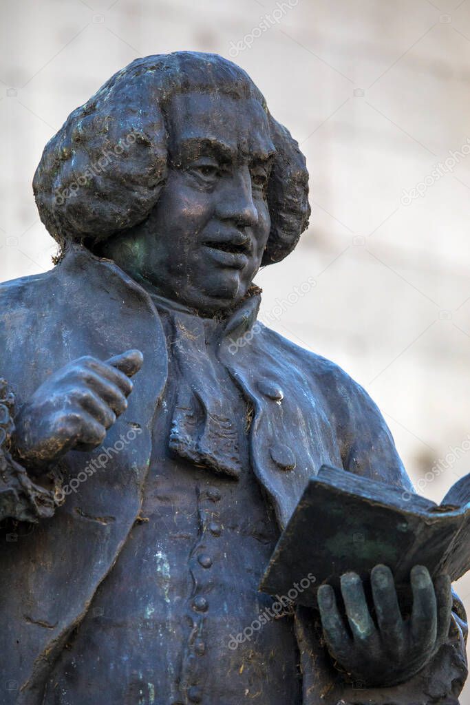 Close-up of the statue of Samuel Johnson, located on the Strand next to St. Clement Danes Church, in London, UK.