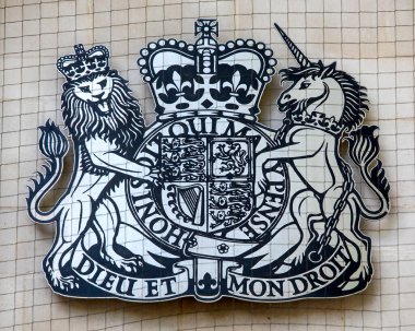 London, UK - April 20th 2022: The UK coat of arms displayed on the exterior The Supreme Court building, located on Parliament Square in Westminster, London, UK.