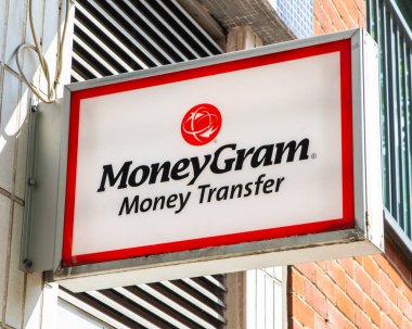 London, UK - May 5th 2022: A sign above the exterior to a shop in London, advertising MoneyGram Money Transfer. clipart