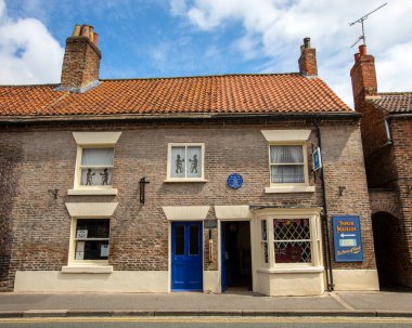 Thirsk, UK - June 7th 2022: Thirsk Museum in Thirsk, North Yorkshire, UK. The building is also the birthplace of Thomas Lord, founder of Lords Cricket Ground. clipart