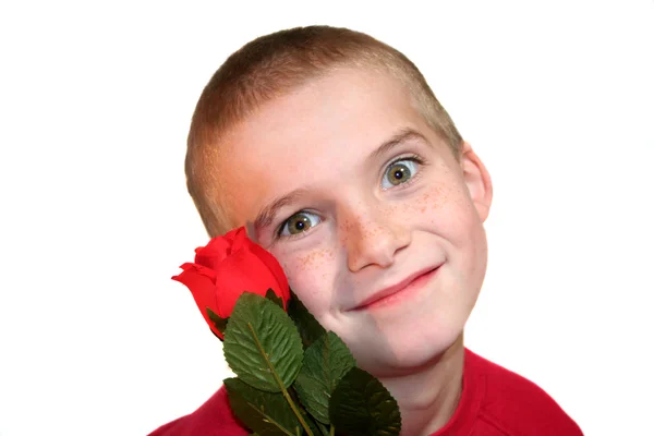 Verrückter Junge mit roter Rose — Stockfoto