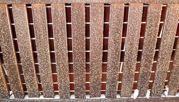 Bench decorated with snow flakes — Stock Photo, Image