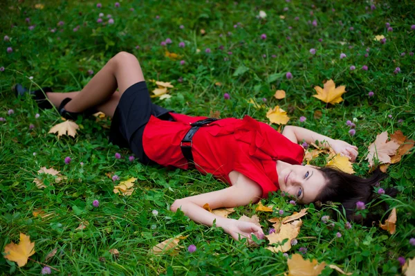 Beautiful girl in a red blouse — Stock Photo, Image