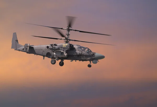 Attack helicopter in red sky — Stock Photo, Image